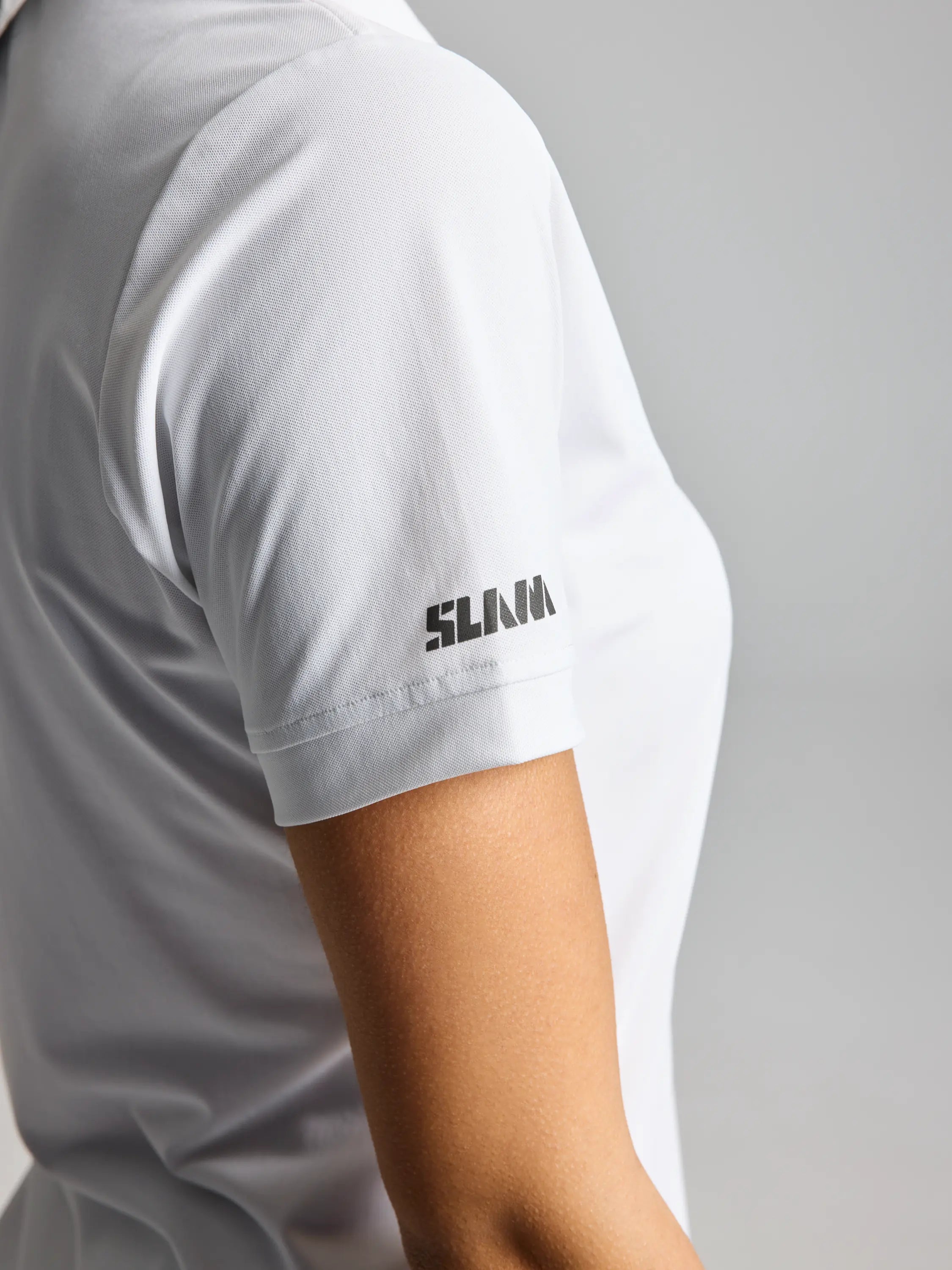 Polo técnico manga corta protección solar UPF 50+ mujer blanco SLAM